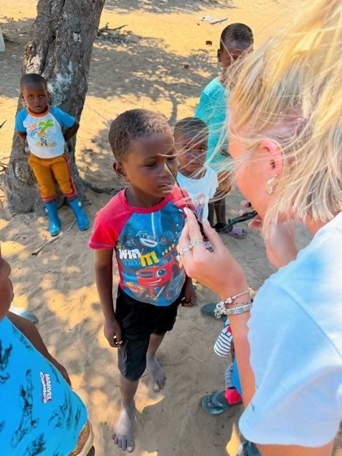 A young child being cared for during a Goodwill community visit