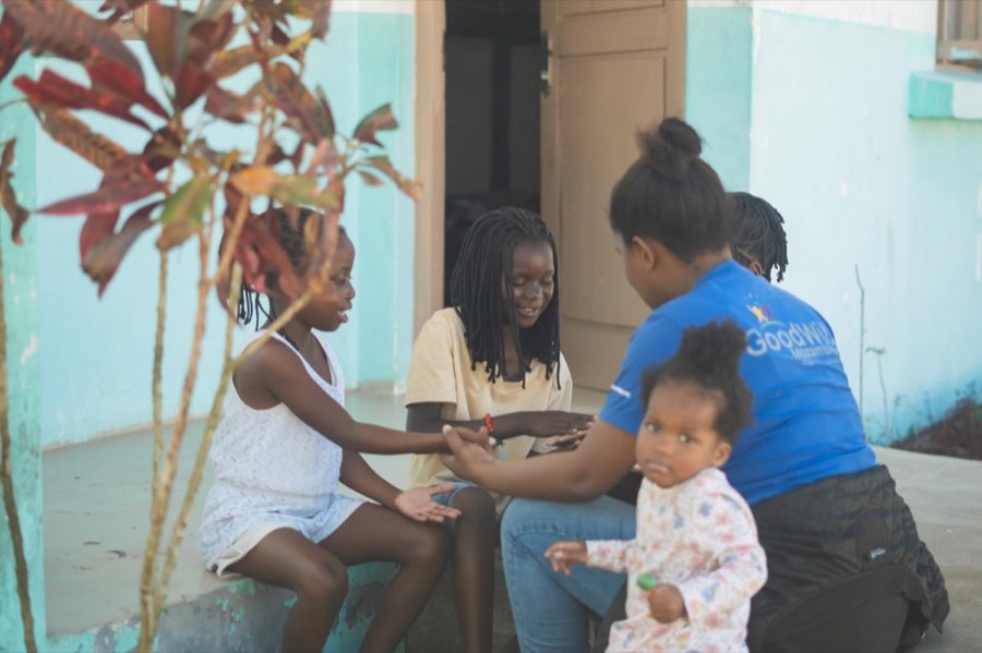 Children and staff in the doorway of the Goodwill home